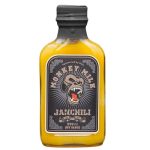 Amber hot sauce bottle with a black label featuring a snarling monkey illustration and the word 'JANCHILI'
